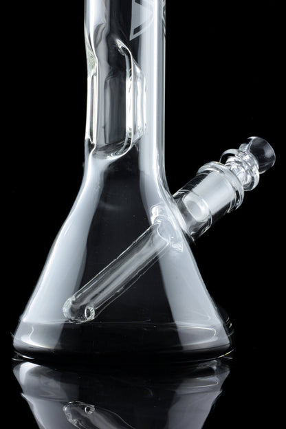 Clear glass water pipe (bong) with ice catcher, reflected on a black surface.