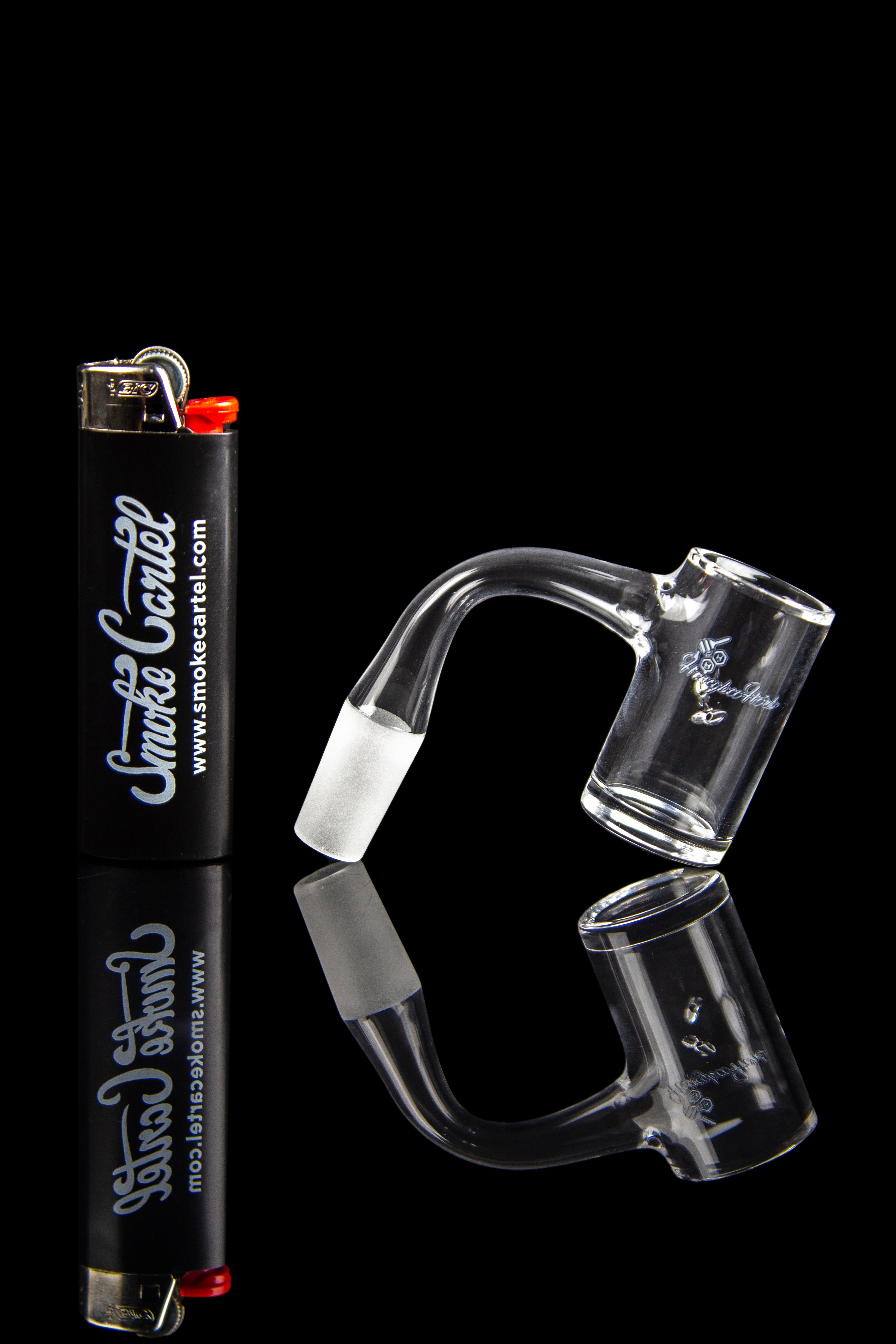 Glass dab rigs and a lighter against a black background, branded with "Smoke Cartel."