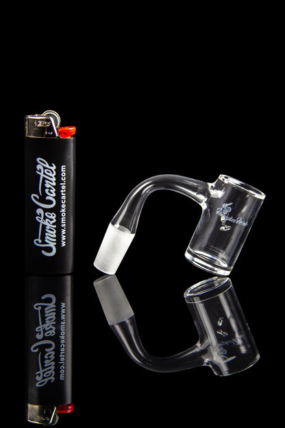 Glass dab rigs and a lighter against a black background, branded with "Smoke Cartel."