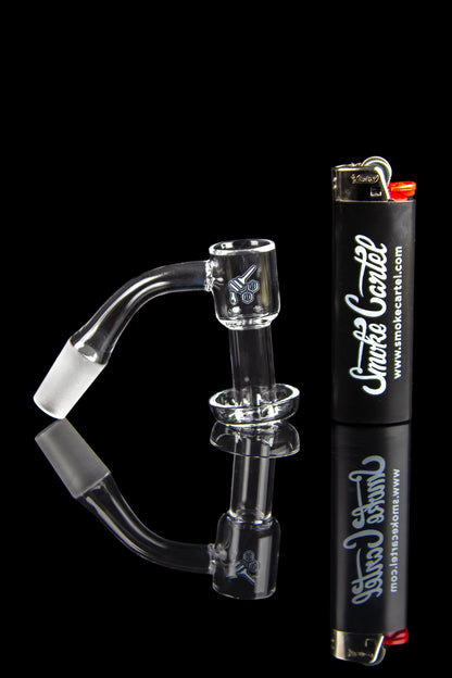 Clear glass dab rig with a quartz banger, alongside a lighter, branded with "Smoke Cartel."
