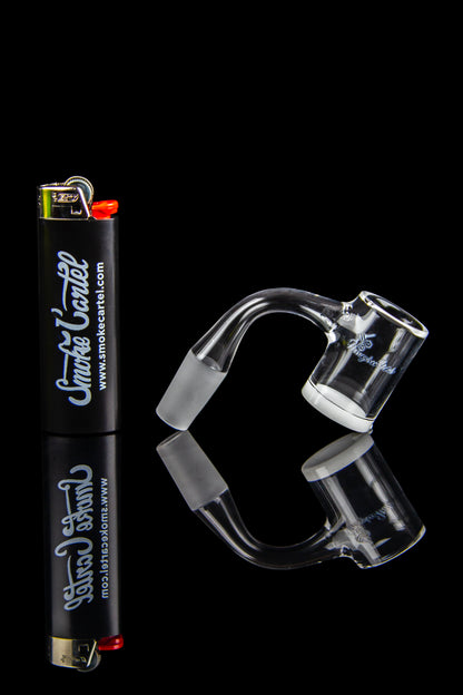 Clear glass dab rig and accessories with a lighter, on a black background.