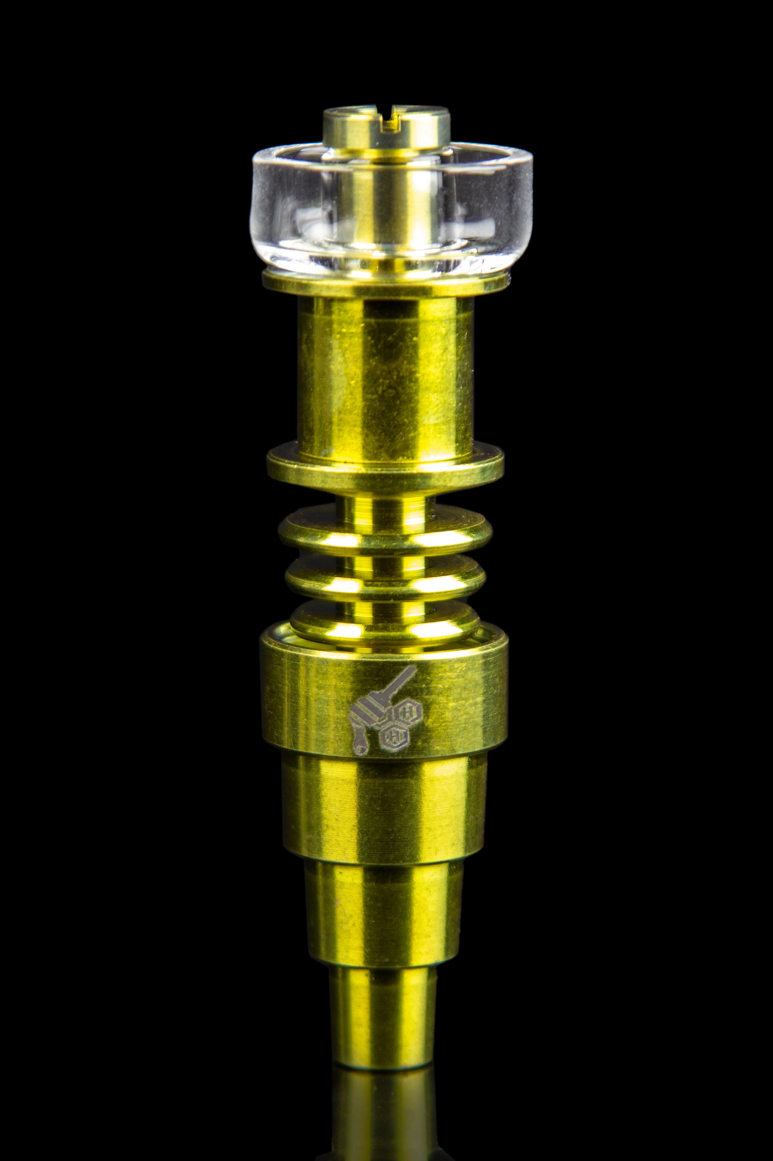 Gold-colored titanium e-nail with a quartz banger, isolated on a black background.