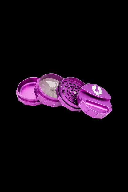 Purple four-piece cannabis grinder with disassembled components displayed on a black background.