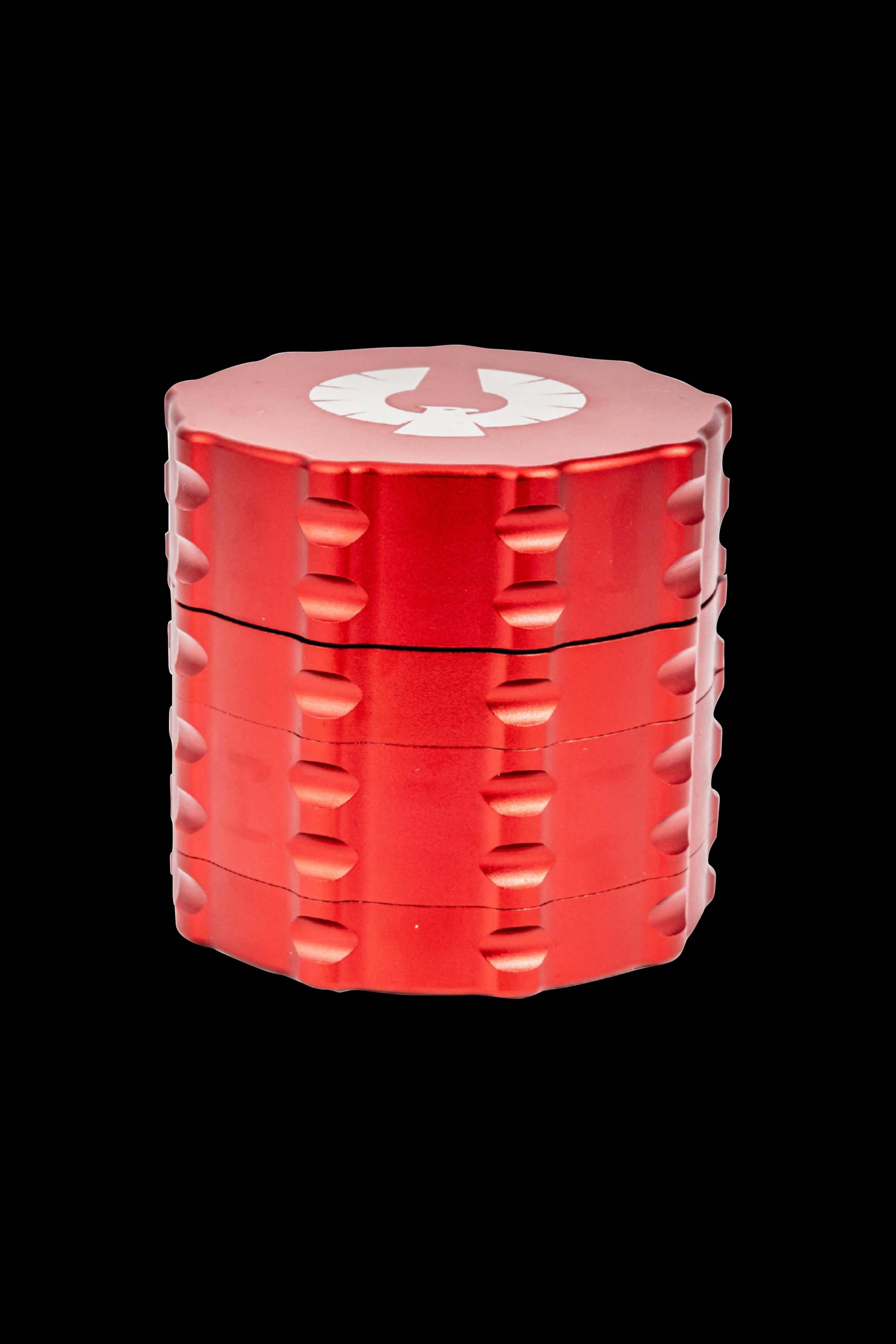 Red four-piece metal grinder with a logo on the lid.