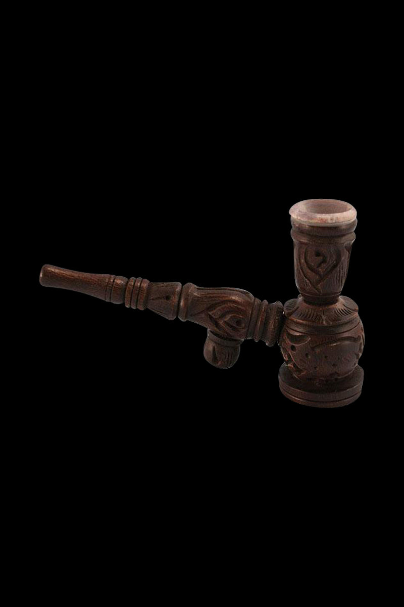 A side view of the Wooden "Hukka" Pipe with a stone bowl insert, showing its detailed wooden carving and dark finish.
