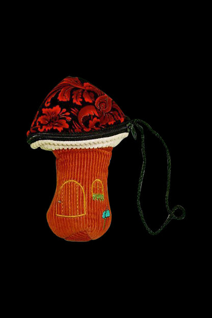 Front view of the ThreadHeads Corduroy Mushroom Padded Pouch, a softly textured, rounded case with a dark cord for hanging.