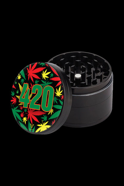 Black metal grinder with a lid decorated with cannabis leaves and the number “420”.