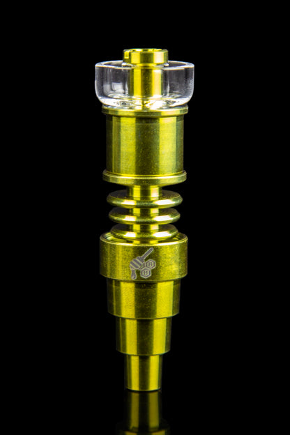 Gold cannabis dab rig water pipe with glass mouthpiece.
