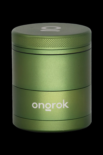 Green four-layer cannabis grinder with “onorok” logo.