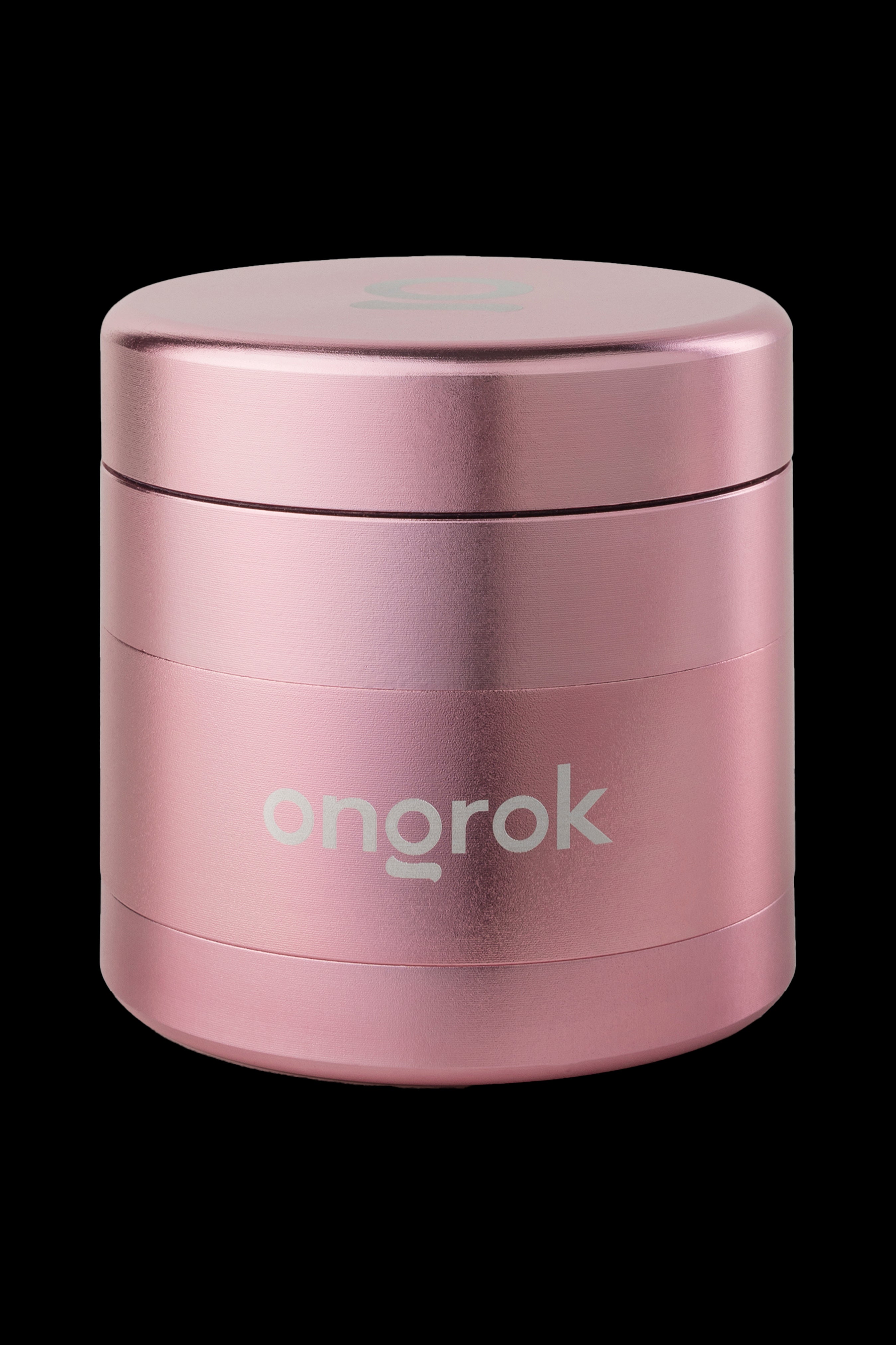 Pink metal cannabis grinder with "ongrok" logo.