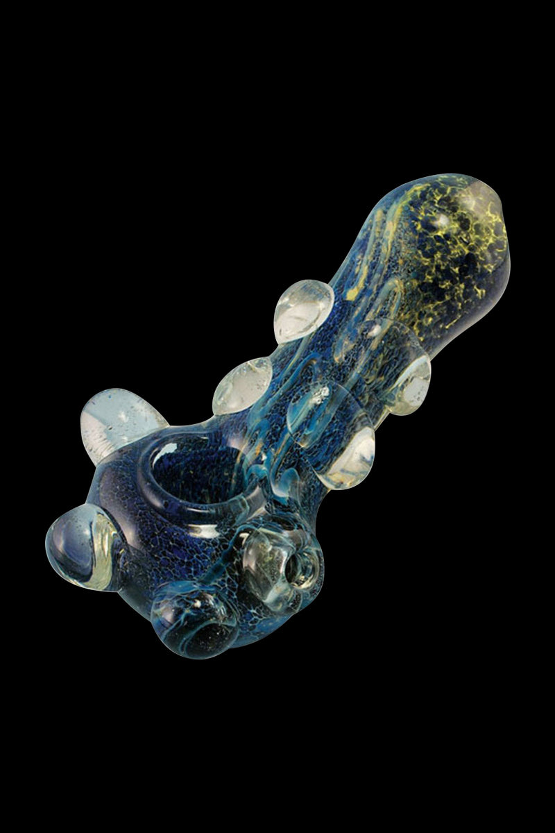A detailed close-up of “The Cosmic Marble” heavy glass pipe showcasing its swirling blue and clear glass design.