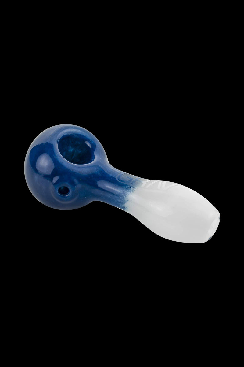 A side view of the GRAV® Frit Spoon, a curved glass pipe with a colorful frit pattern.