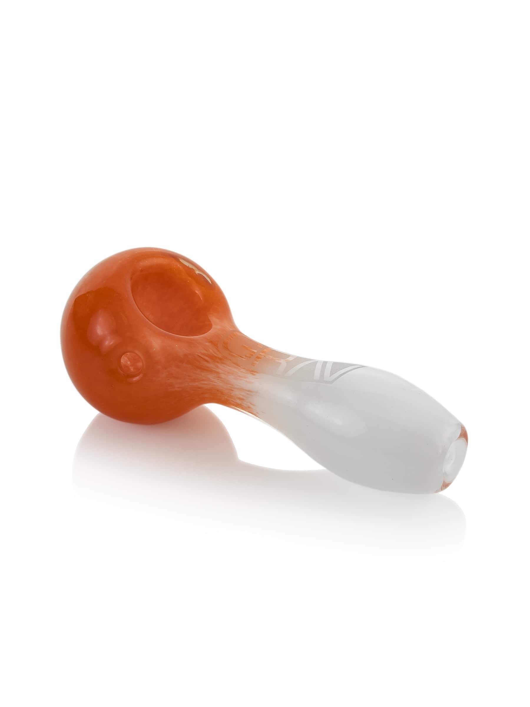 A side view of the GRAV® Frit Spoon, showcasing its curved design and smooth, glass construction against a white background.