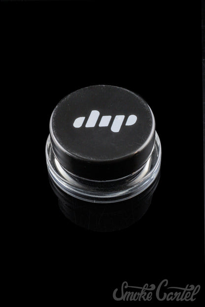 A close-up shot of the clear glass Dip Devices 9mL Container, showing its simple, cylindrical shape and screw-on lid.