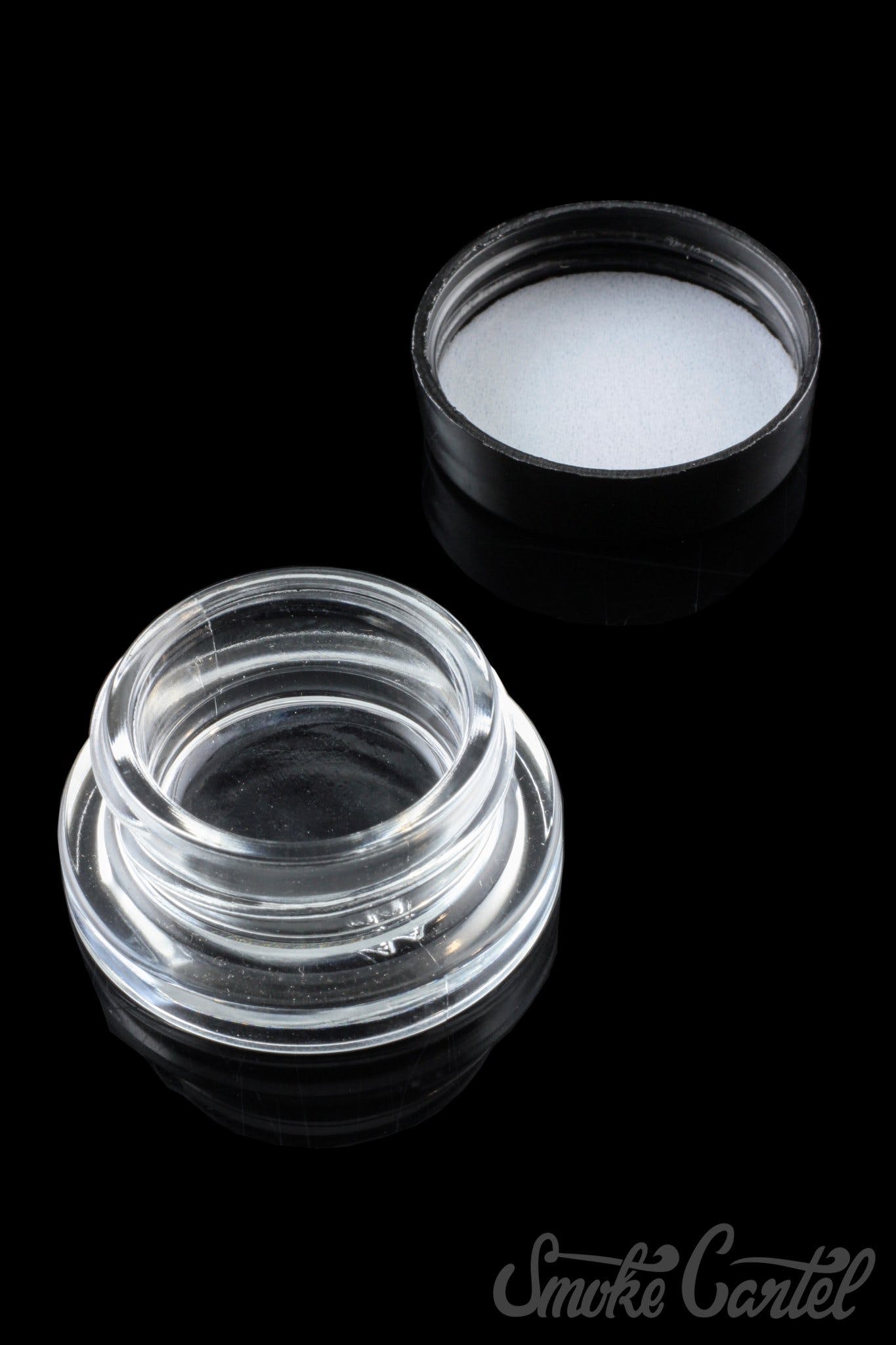 A top-down view of the clear 9mL glass Dip Devices container, appearing empty and reflecting light.