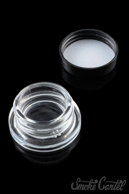 A top-down view of the clear 9mL glass Dip Devices container, appearing empty and reflecting light.
