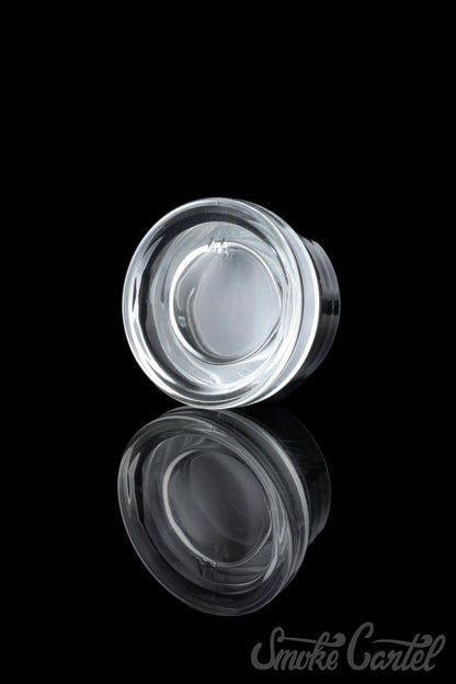 A studio shot of the 9mL Dip Devices glass container, showcasing its clear, cylindrical shape against a dark background.