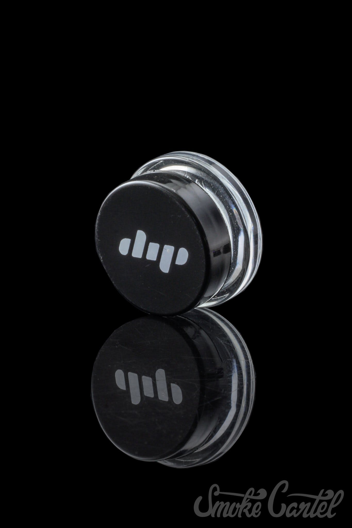Close-up of the Dip Devices 9mL Glass Container, showing its clear glass construction and circular shape against a black background.