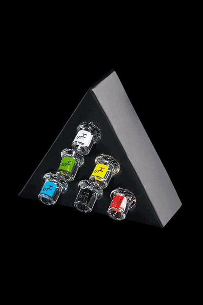 Colorful glass cannabis oil burners displayed against a black triangular backdrop.