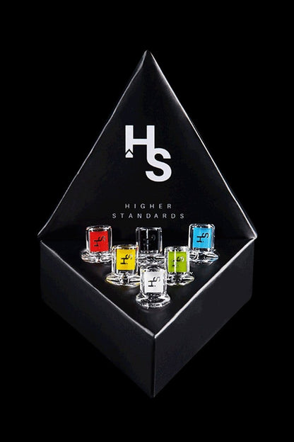 Black geometric display case showcasing colorful cannabis oil cartridges branded with “HS” for Higher Standards.