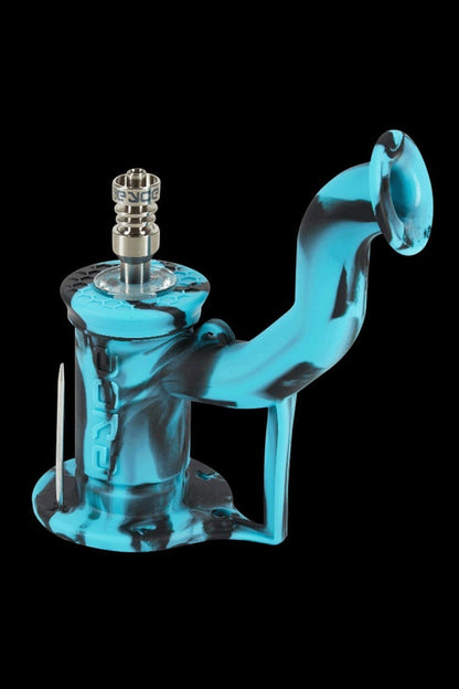 Blue and black silicone oil rig with a quartz banger and dab tool.