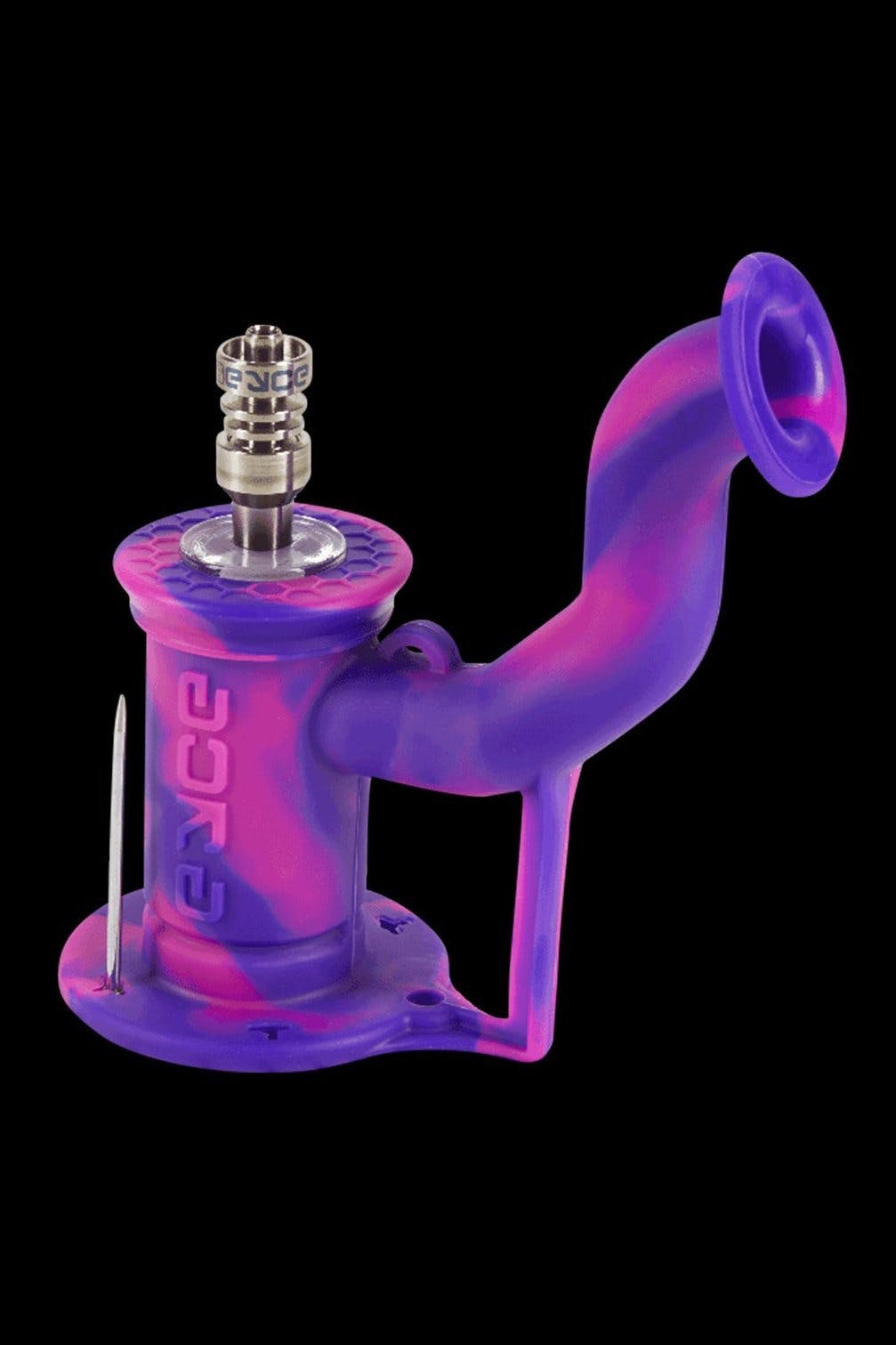 Pink and purple glass water pipe with metal downstem, isolated on a black background.