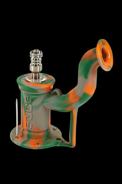 Green and orange silicone rig with a metal downstem and bowl, isolated on a black background.