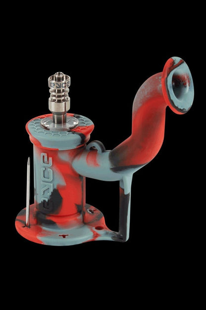 Silicone cannabis rig with a glass bowl and dab tool.