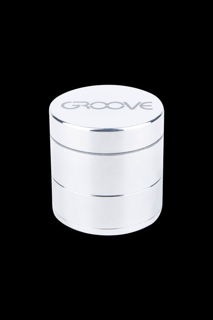 Silver four-layer cannabis grinder with "GROOVE" logo.