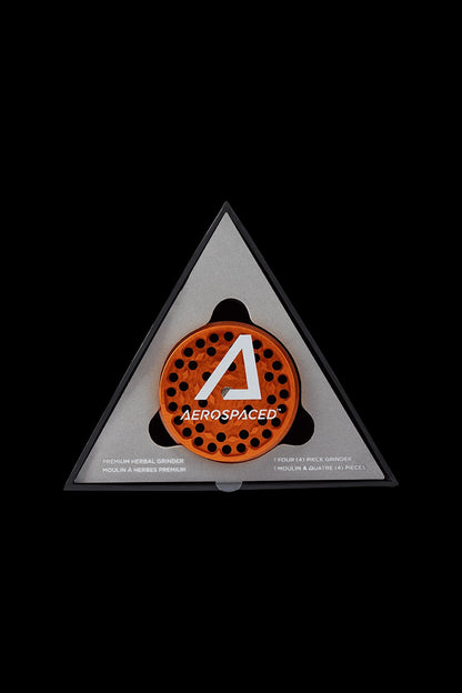 A triangular, metallic cannabis grinder with a perforated orange interior and the brand name "AEROSPACED" displayed in white.