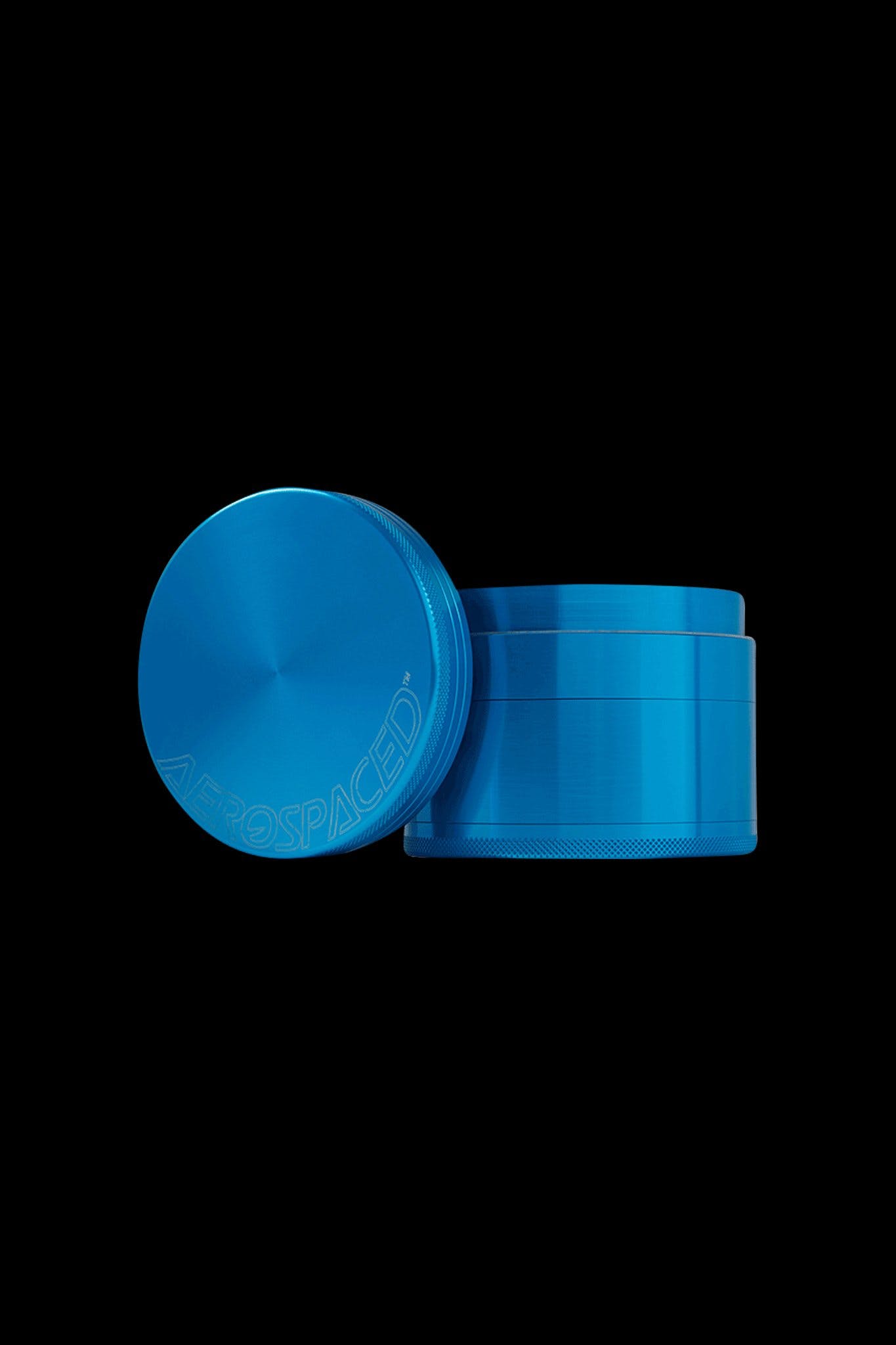 Blue four-piece metal grinder with "AEROSPACED" etched on the lid.