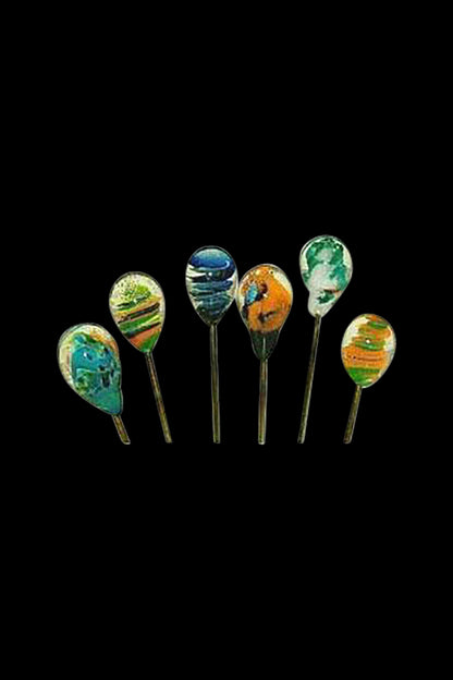 Row of six Handblown Glass Hair Pin / Poker pins with colorful teardrop glass heads against a black background