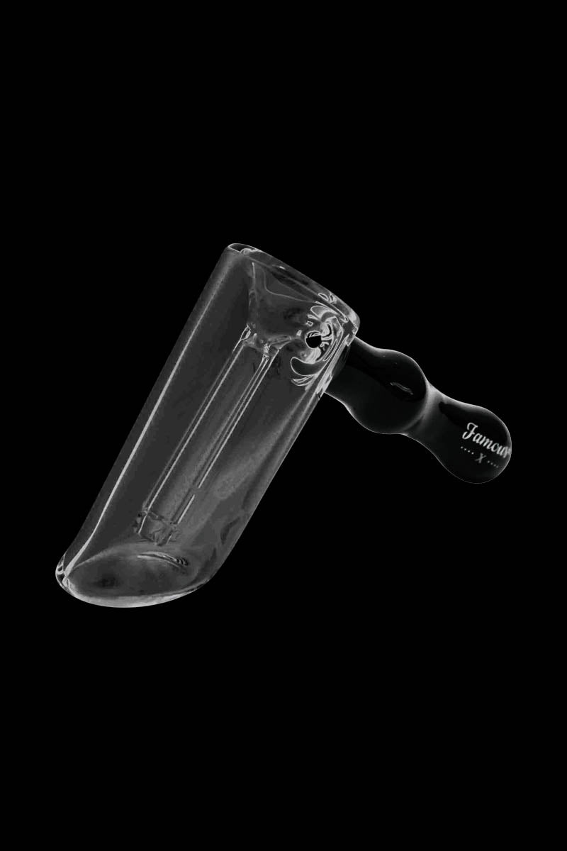 Angled side view of the clear glass Famous X Straight Hammer Bubbler Pipe against a solid black background.