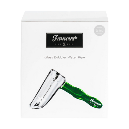 Angled close-up of the Famous X Straight Hammer Bubbler Pipe showing a clear glass chamber and a green hammered handle on a white background