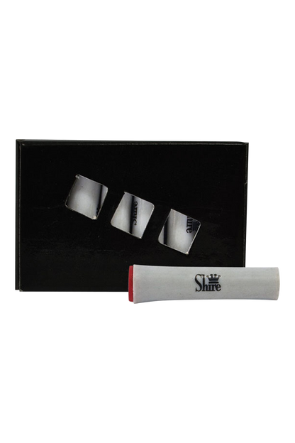 A top-down view of the Pulsar Replacement Charcoal Filters - 6 Pack, neatly arranged in their packaging on a black surface.