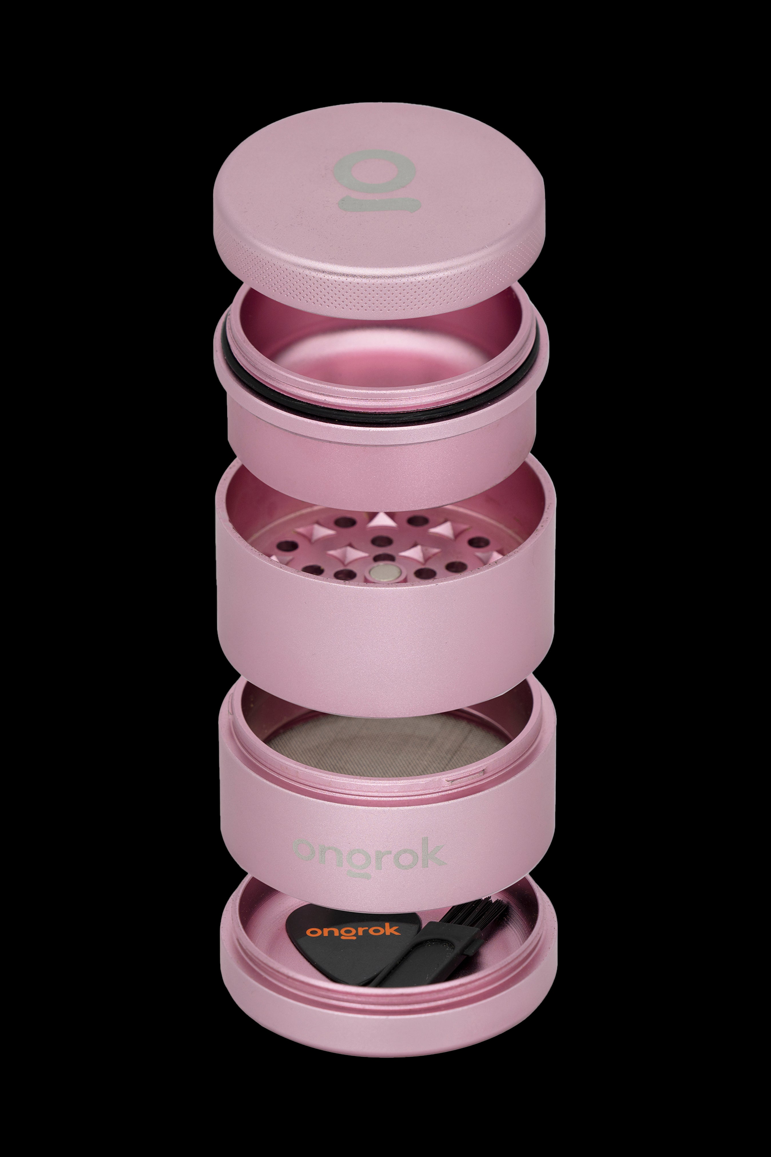 Pink four-piece cannabis grinder with the “onrok” logo.