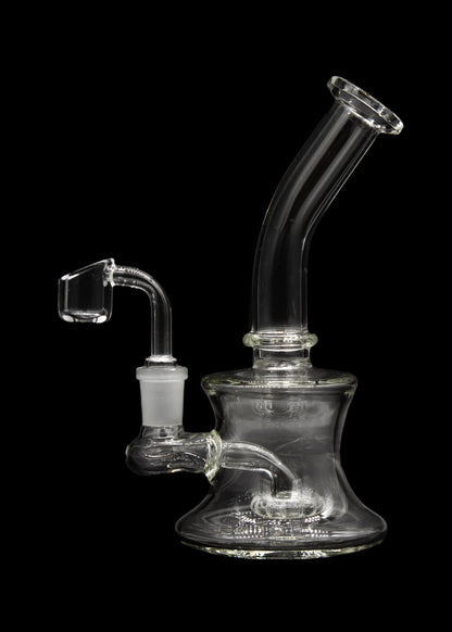 Clear glass dab rig with a quartz banger, isolated on a black background.