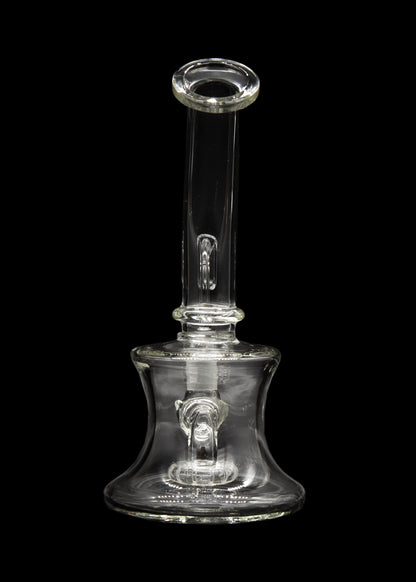 Clear glass water pipe (rig) with bubbler, isolated on black.