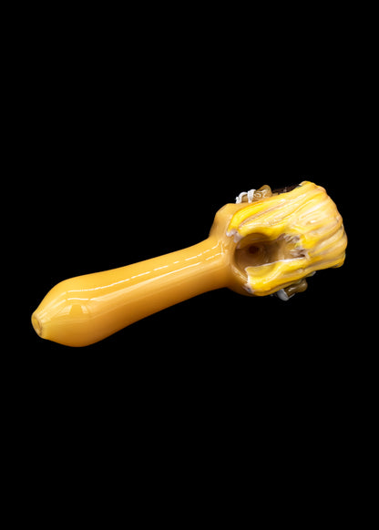Yellow glass pipe with textured grip.