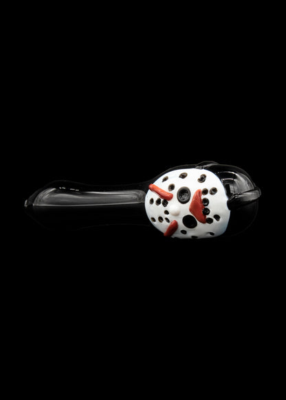 Glass cannabis pipe shaped like a clown head with red accents, against a black background.