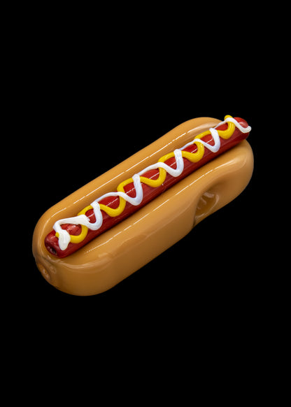 Glass pipe shaped like a hot dog with mustard and relish.