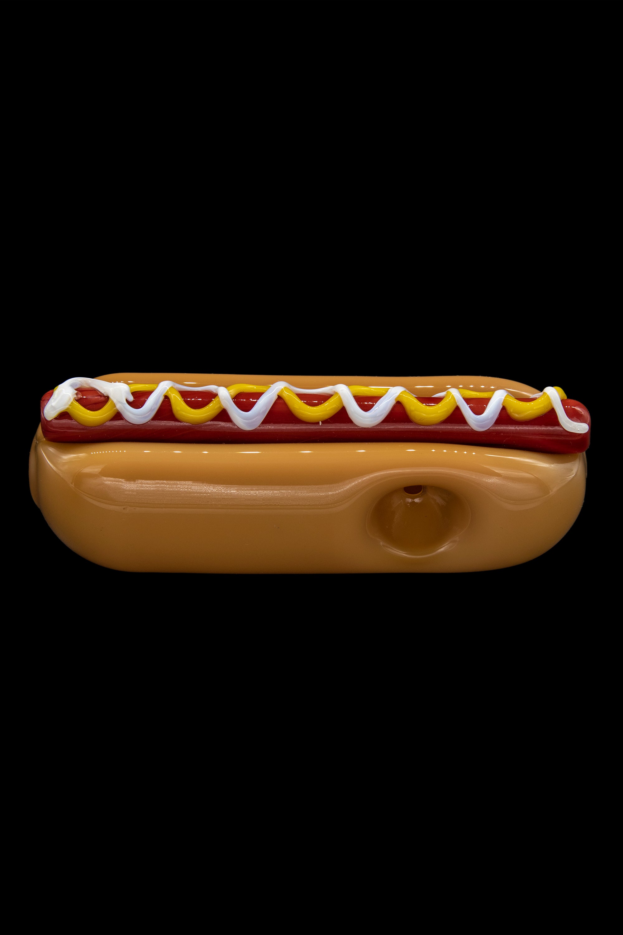 Glass pipe shaped like a hot dog with mustard and ketchup.