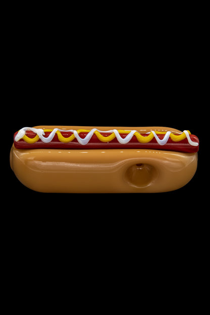 Glass pipe shaped like a hot dog with mustard and ketchup.