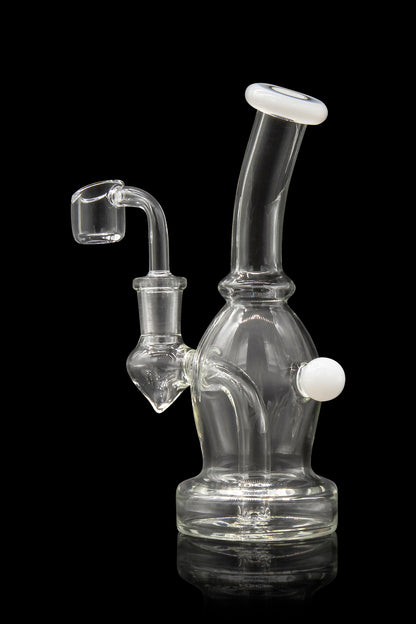 Clear glass dab rig with a quartz nail, isolated on black.