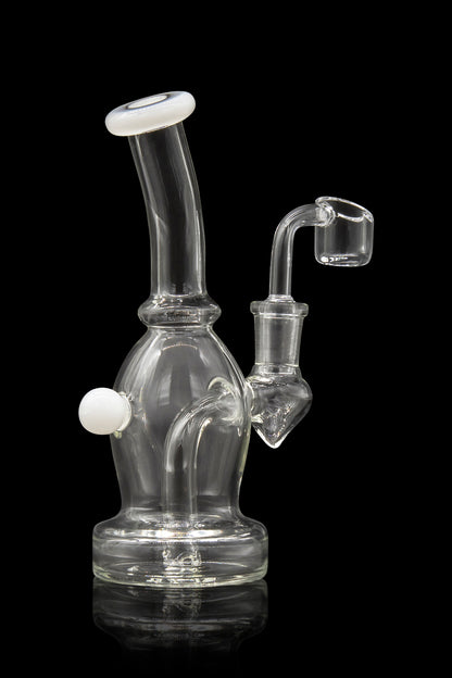 Clear glass water pipe (rig) with a quartz banger, isolated on black.