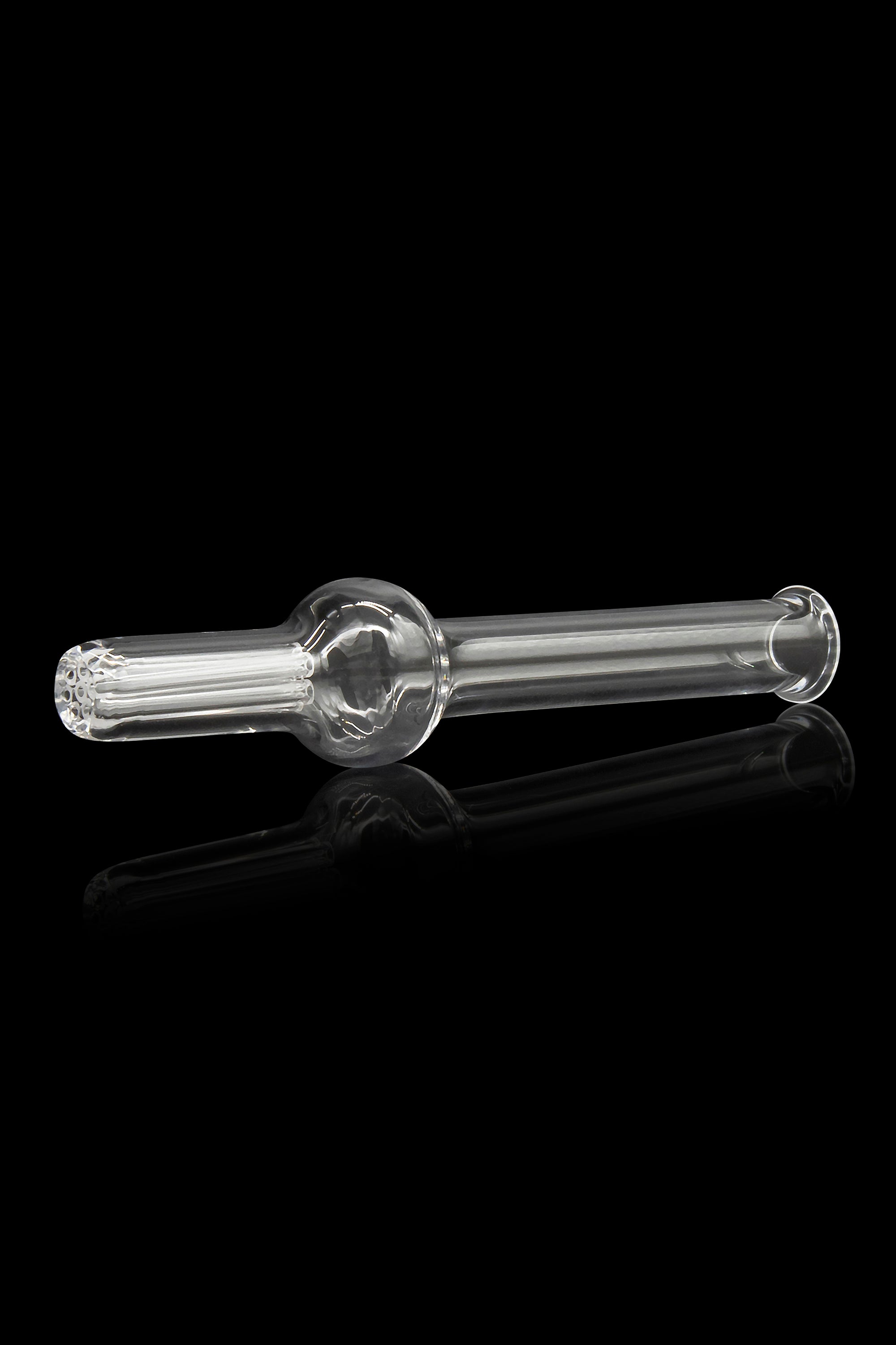 Clear glass oil burner pipe with textured mouthpiece and bowl, reflecting on a dark surface.