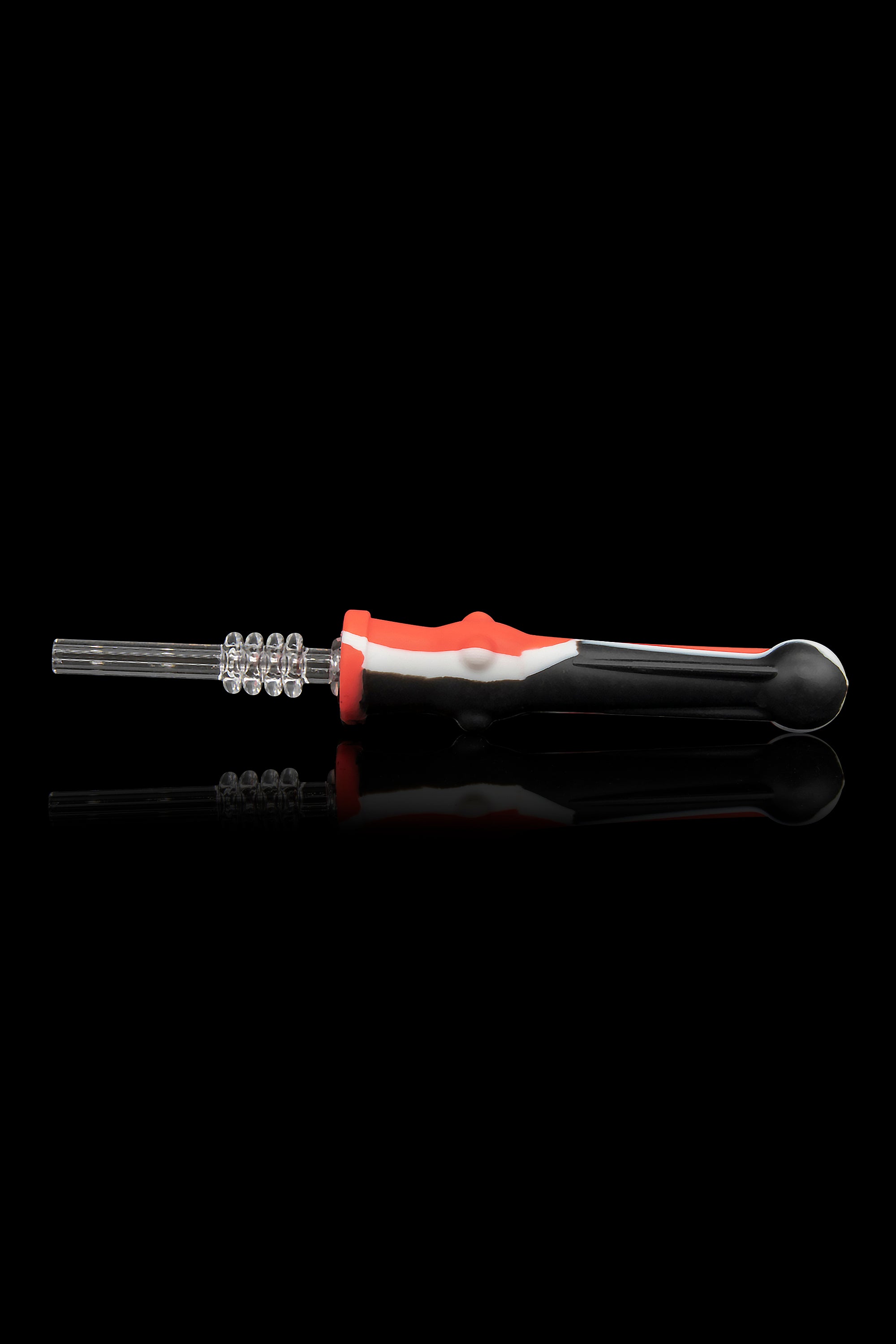 Glass dab tool with a patterned tip and red, white, and black handle, displayed with its reflection on a black background.