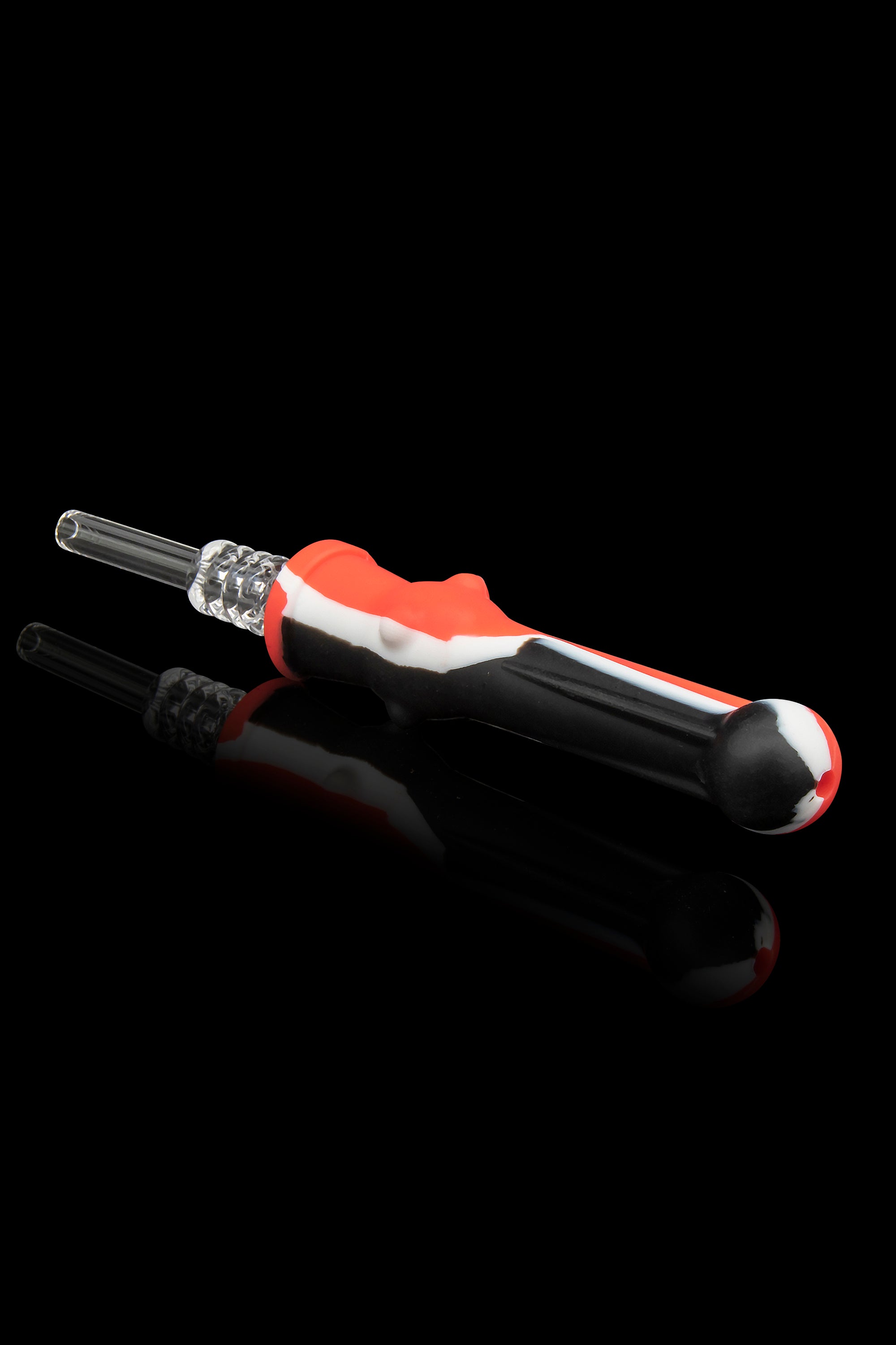 Red and black dab tool with glass tips, isolated on a black background.