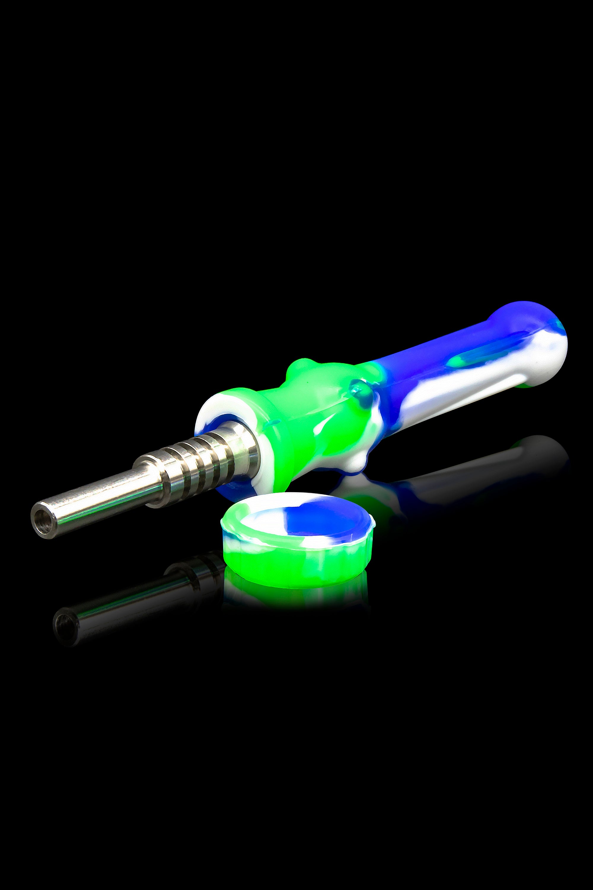 Colorful silicone dab tool with titanium tip and storage container on a reflective black surface.