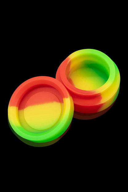 Two colorful silicone concentrate containers with red, yellow, and green gradients.